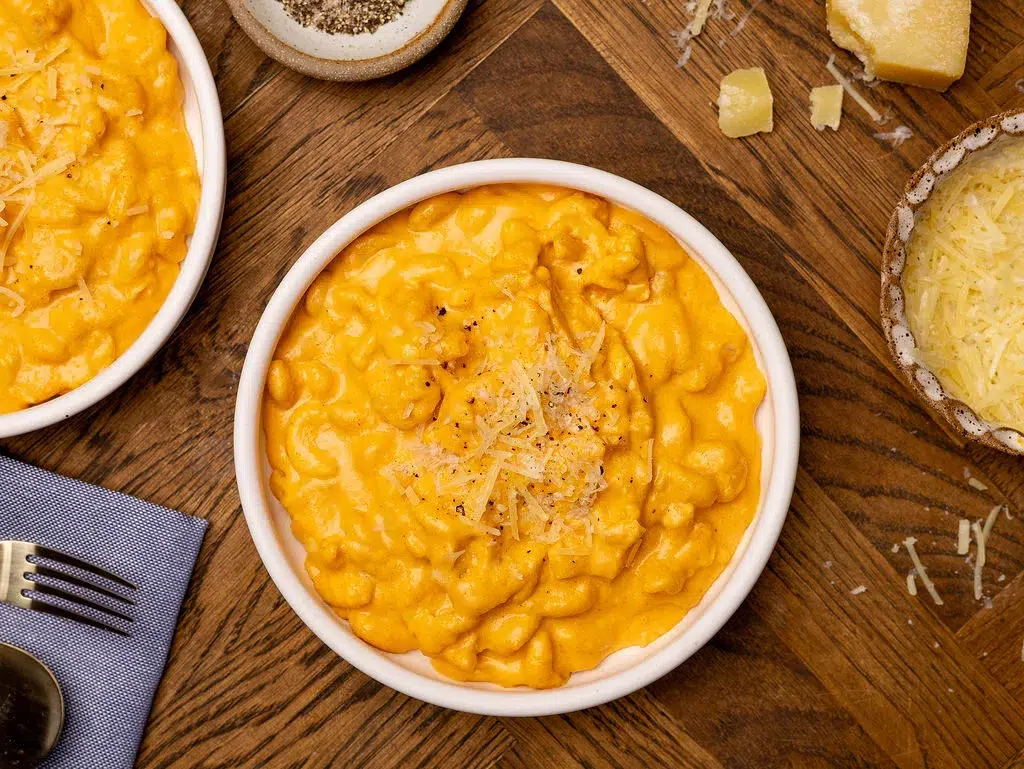 Aerial view of slow cooker mac and cheese in a white bowl.