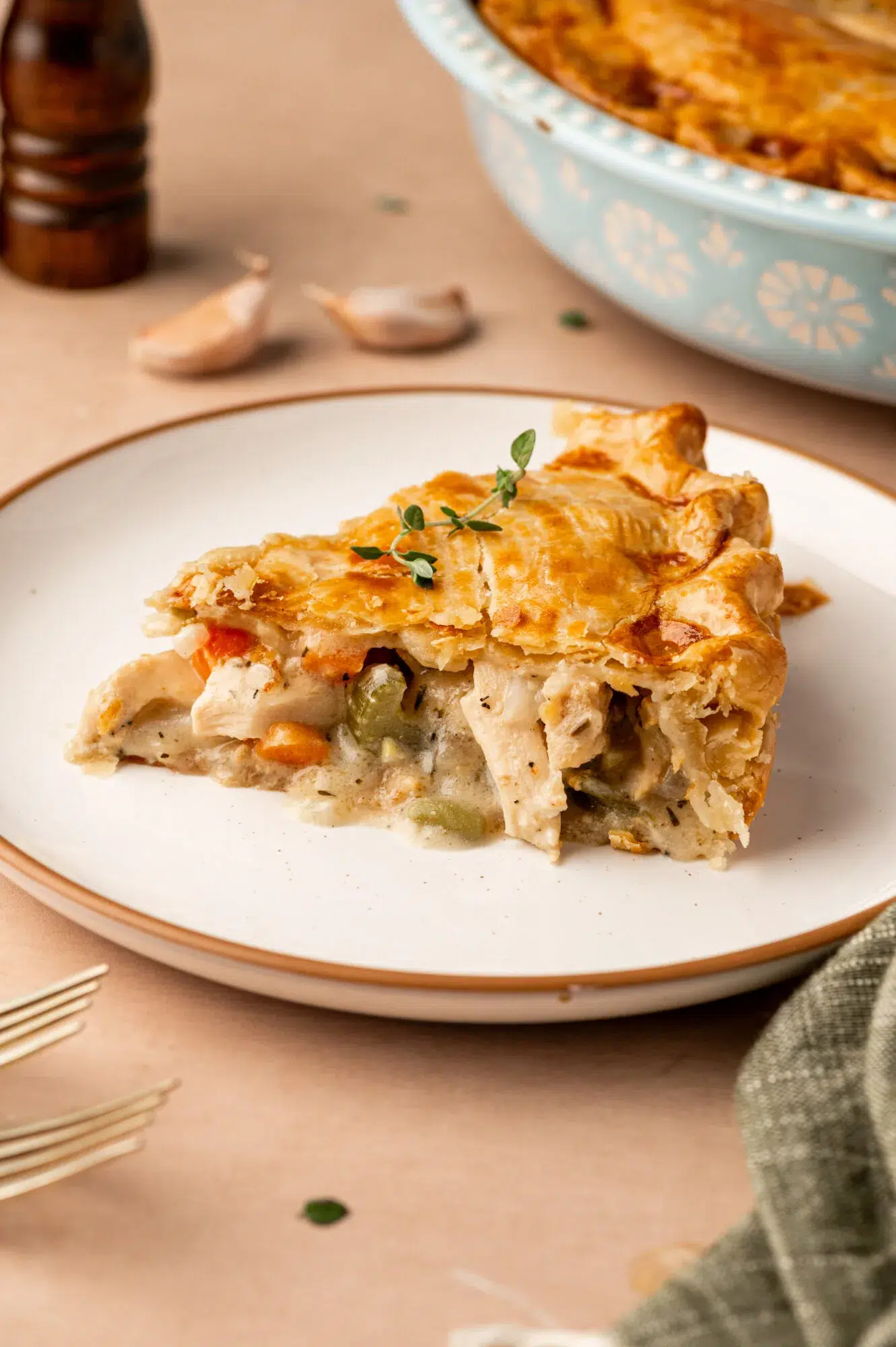 A slice of turkey pot pie on a white plate.