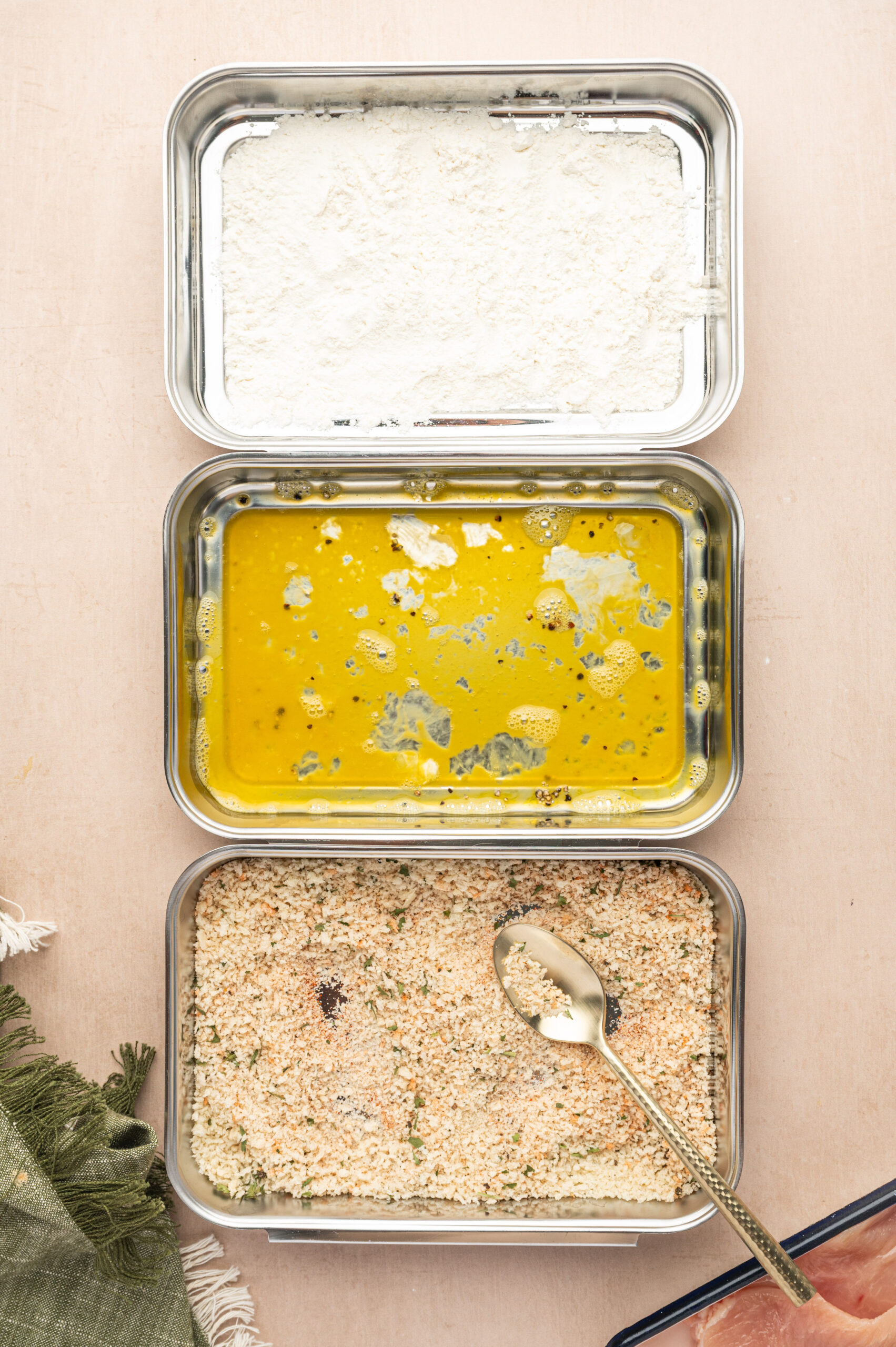 Breading station for air fryer chicken cutlets.