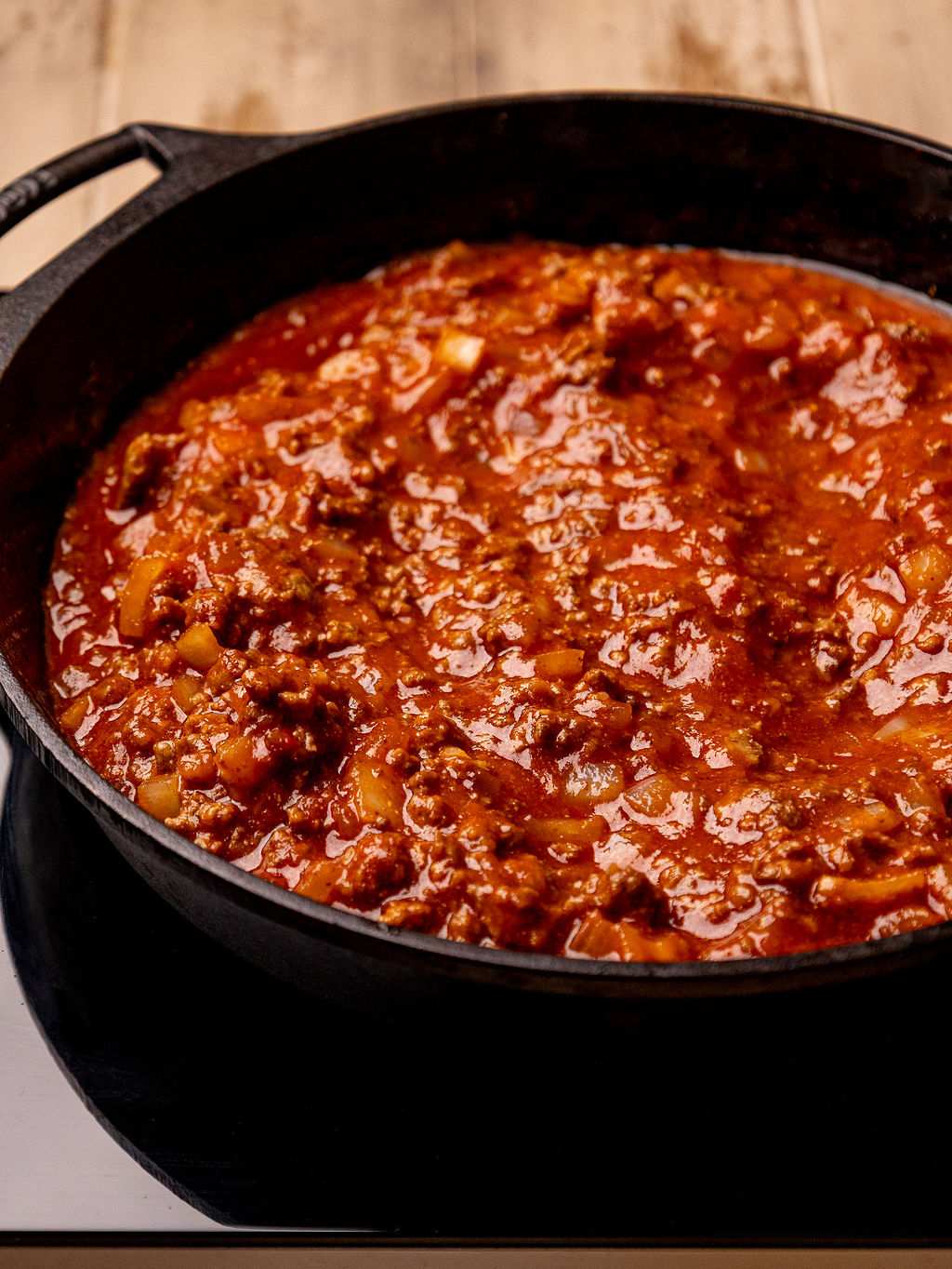 Meat sauce for sloppy joe biscuit bake in a cast iron skillet.