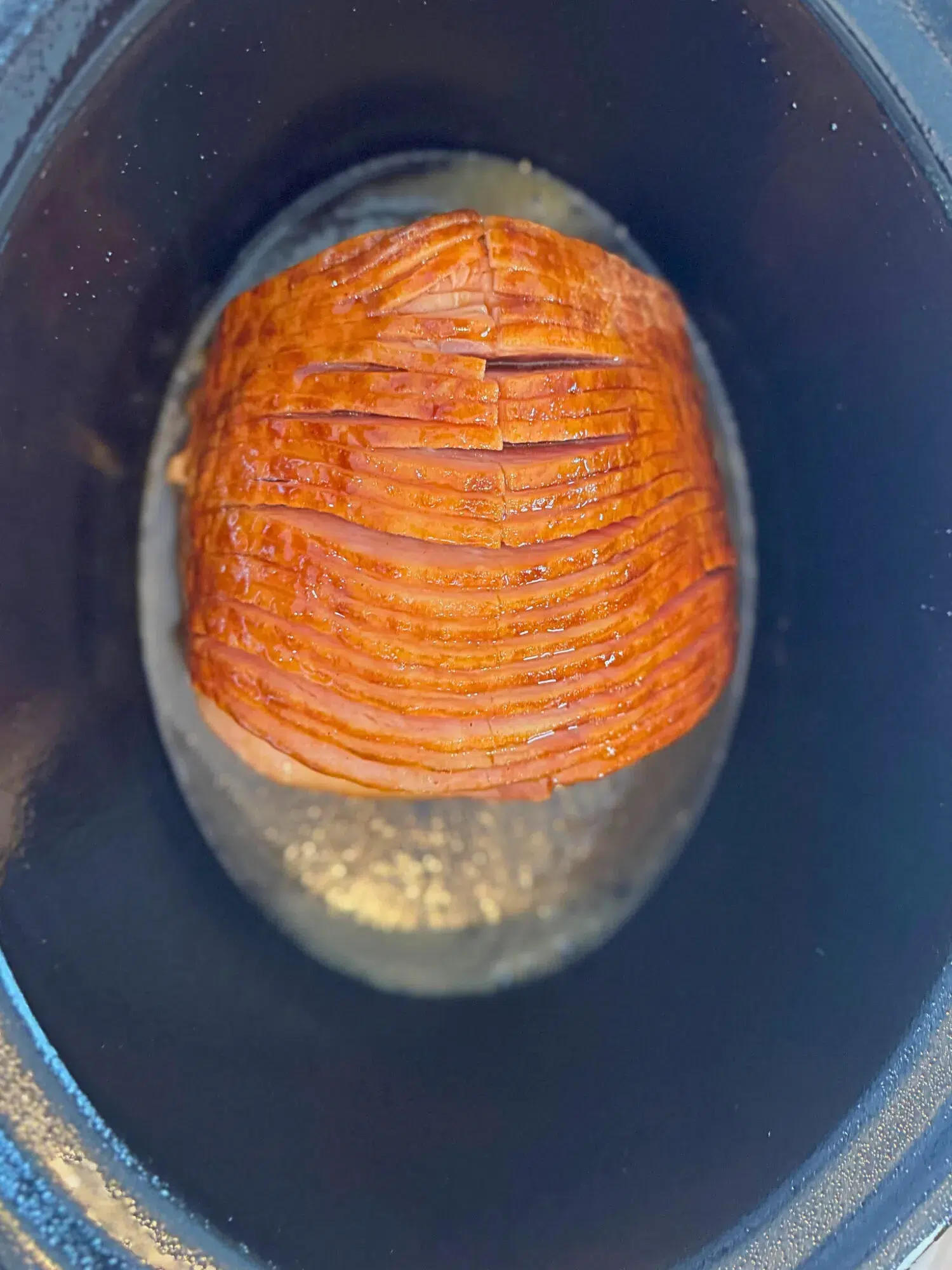 Honey glazed ham in a slow cooker.