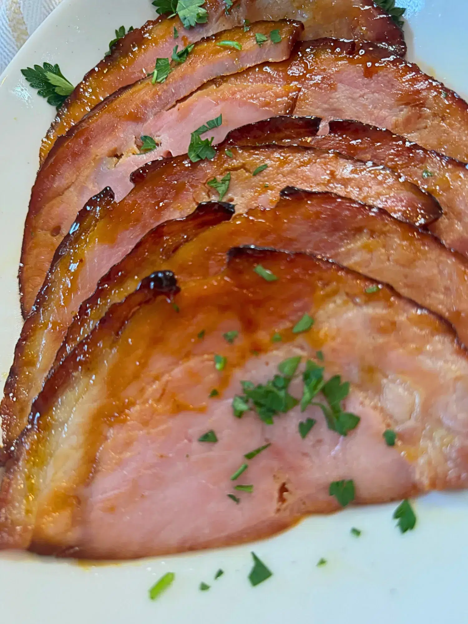 Close-up of sliced honey glazed ham.