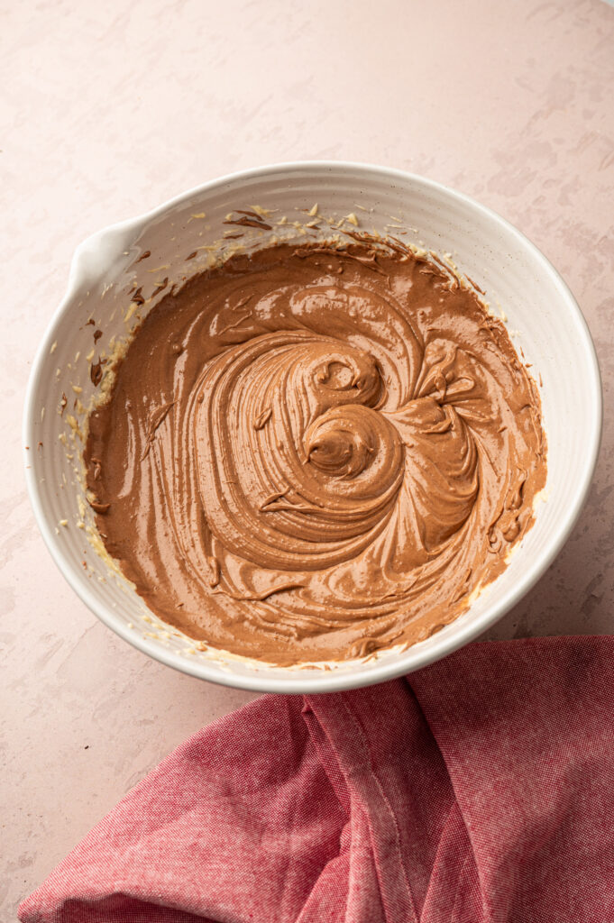 Mixed wet ingredients in a white bowl.