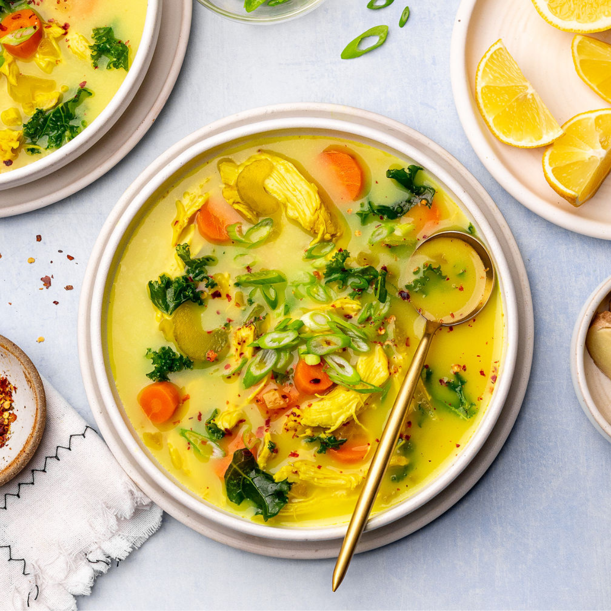 Immunity chicken soup in a bowl with a spoon.