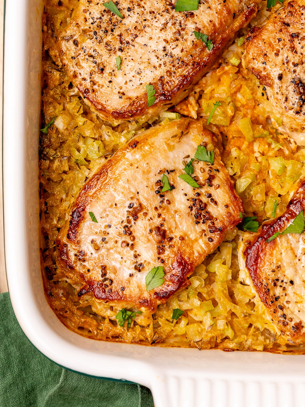 Close-up of pork chop and rice casserole fresh out of the oven.