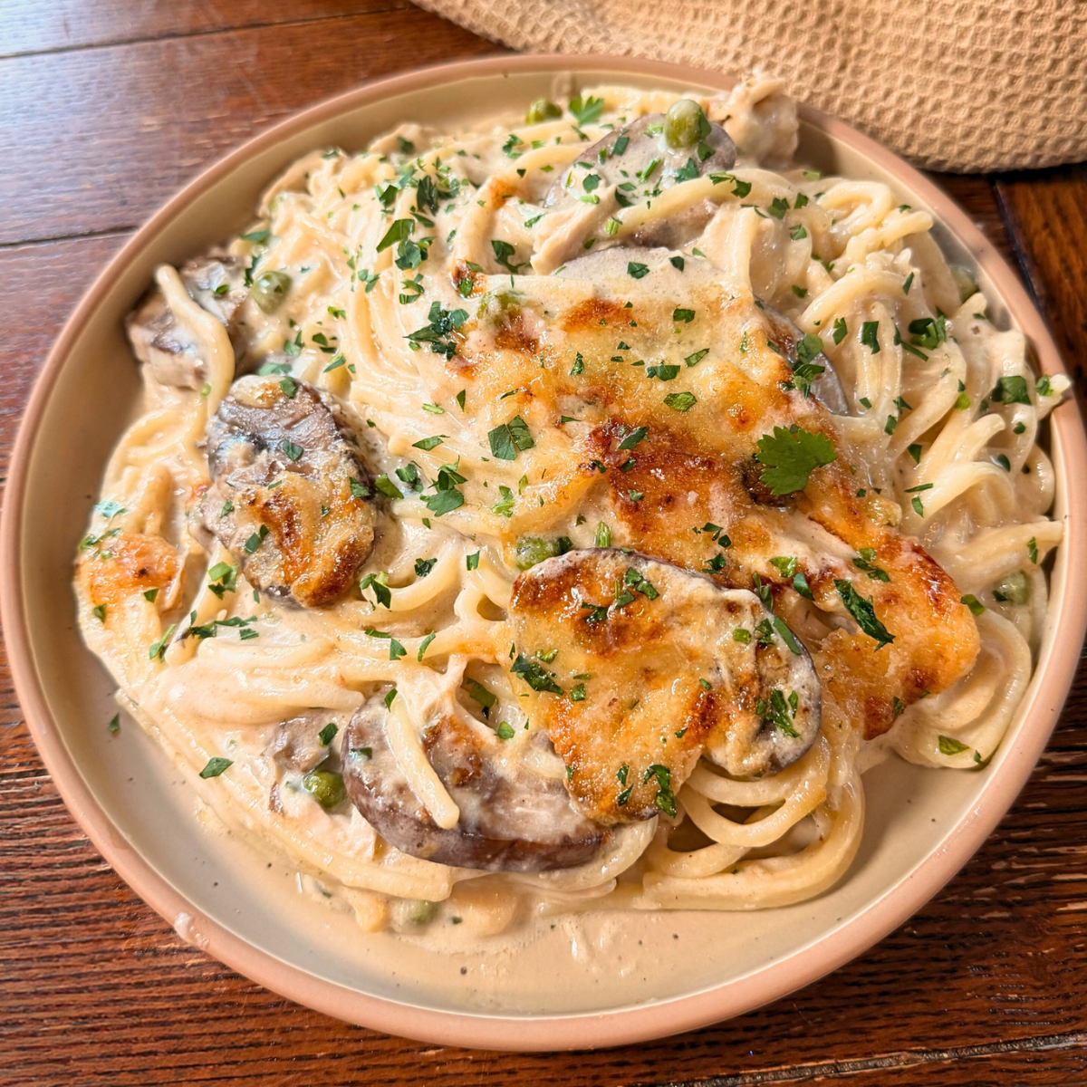 Turkey Tetrazzini on a plate topped with fresh parsley.