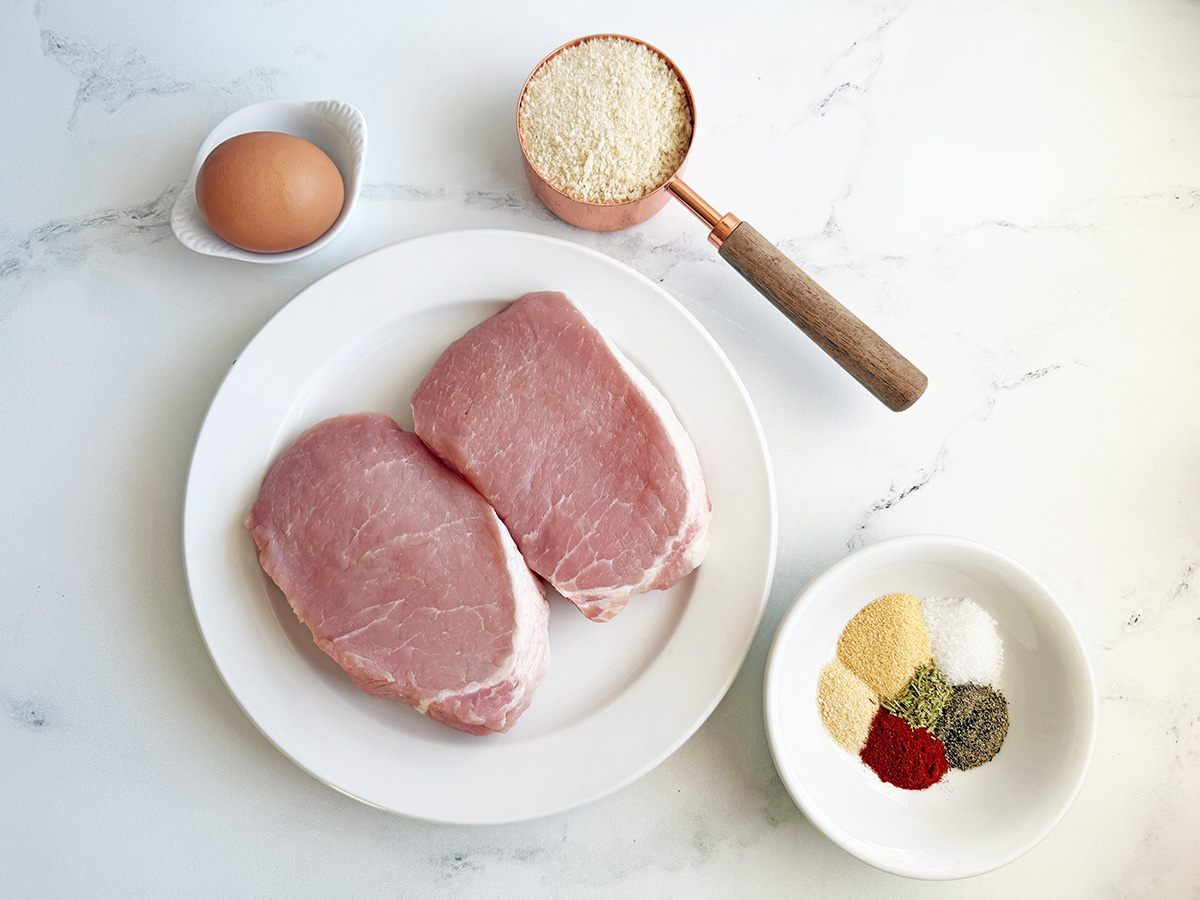 All the ingredients needed to make breaded air fryer pork chops.
