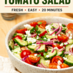 A bowl of cucumber tomato salad with cherry tomatoes, red onion, parsley, and feta. The graphic reads “Cucumber Tomato Salad — Fresh, Easy, 20 Minutes” with RecipeTeacher.com at the bottom.